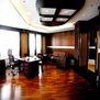 Classy interior with wooden flooringand aesthetic false ceiling
